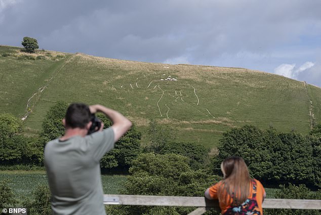 Cerene Abbas Giant undergoes historic re-chalking to preserve 700-year-old chalk figure.